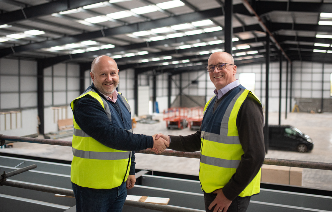 Monmouth Scientific Founder David Pomeroy (Left) welcomes incoming Managing Director Alan Holcombe (Right) to the company’s new headquarters, currently under construction on Bristol Road in Bridgwater, Somerset